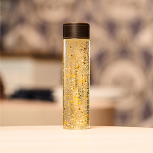 Bouteille sensorielle doré