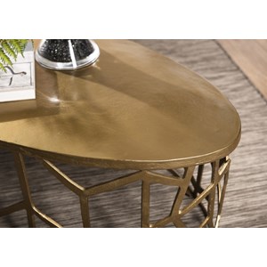 Johan - table basse ovale 150x60cm aluminium doré piètement graphique