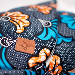 Gigoteuse emmaillotage coton wax fleurs