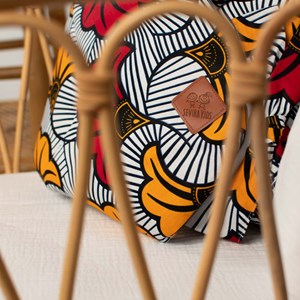 Gigoteuse emmaillotage coton wax fleurs