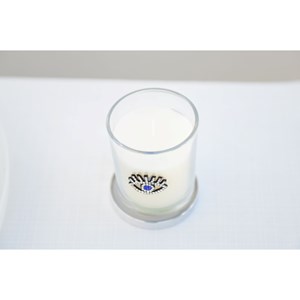 Bougie argent œil parfum patchouli