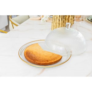Cloche en verre bords dorés sur plat