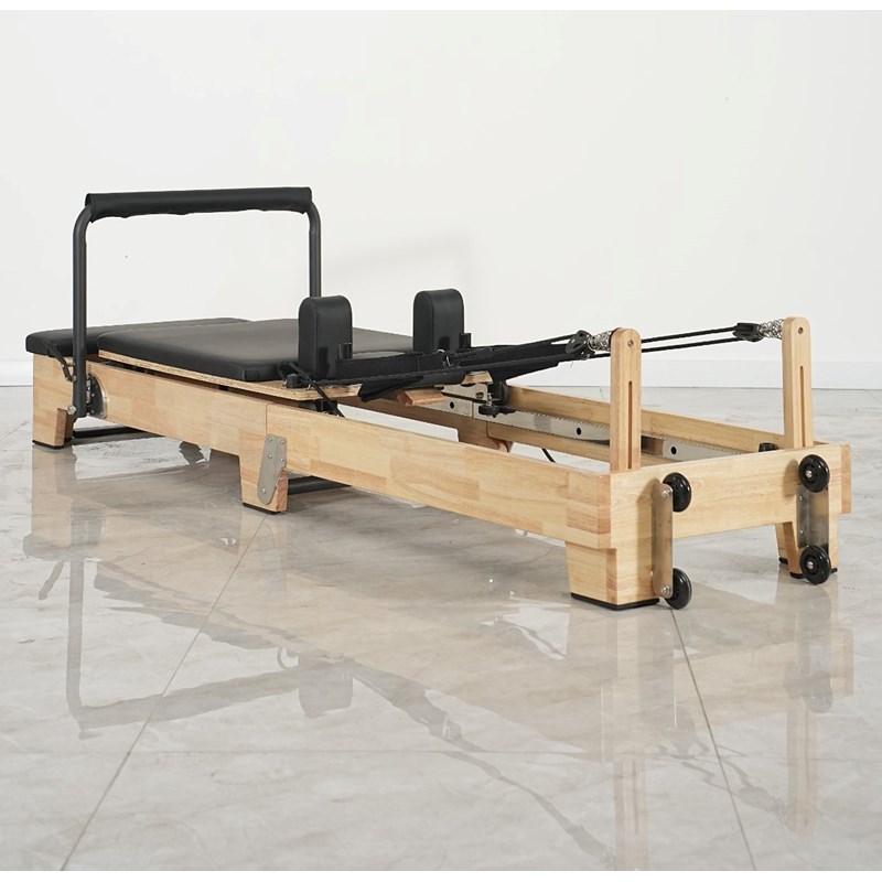 Pilates reformer pliable en bois