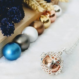 Bola cage - bille rose - arbre