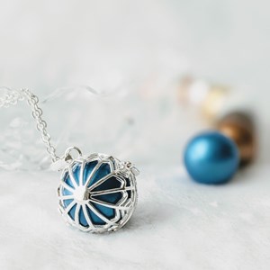 Bola cage - bille bleue - flocon
