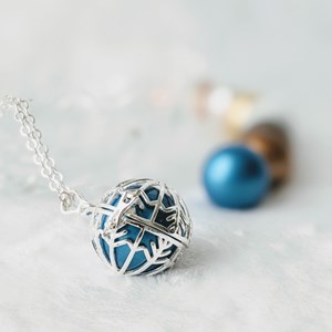 Bola cage - bille bleue - flocon