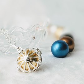 Bola cage - bille dorée - flocon