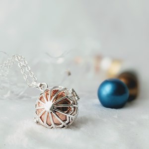 Bola cage - bille rose - flocon