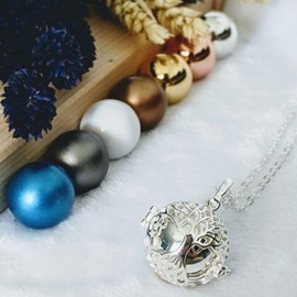 Bola cage - bille argentée - arbre