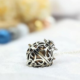 Bola cage - bille bronze - céleste