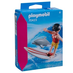 Surfeuse avec un dauphin