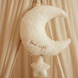 Peluche musicale à suspendre