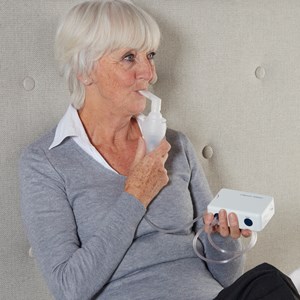 Inhalateur à compression portable