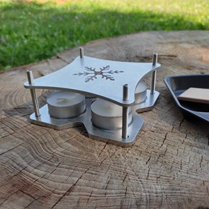 Appareil à raclette à la bougie adapté pour la randonnée et pour la maison.