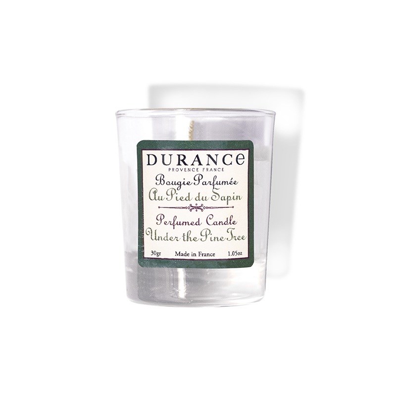 Mini bougie parfumée au pied du sapin