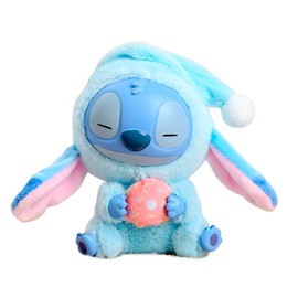 Peluche extra doux et moelleux avec un pendentif. Design de monstre en pyjama.