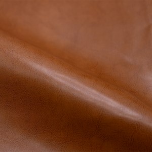 Fauteuil camel en croute de cuir enduite - club