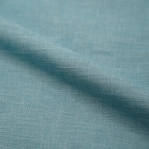 Fauteuil capitonné en tissu bleu clair - carmen