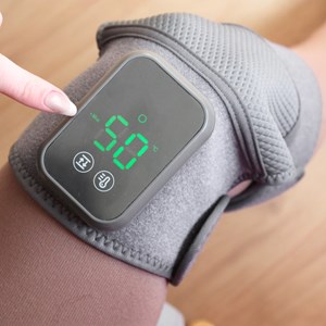 Masseur genou épaule chaleur et vibrations sans fil pour douleurs