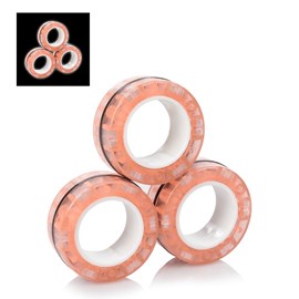 Magnetic fidget glow rings, des anneaux magnétiques, brillent dans l'obscurité.