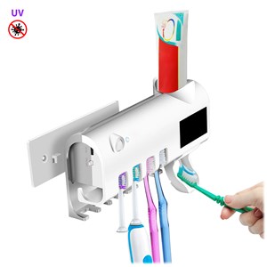 Stérilisateur et support pour 4 brosses à dents avec distributeur de dentifrice.