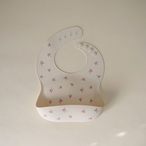Bavoir à poche en silicone bows