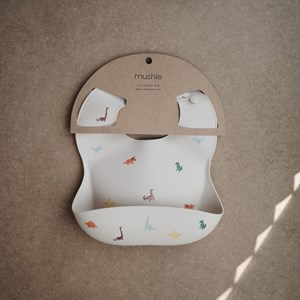 Bavoir à poche en silicone dinosaure