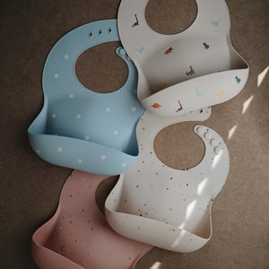 Bavoir à poche en silicone dinosaure