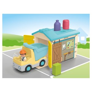 Ouvrier avec camion et garage