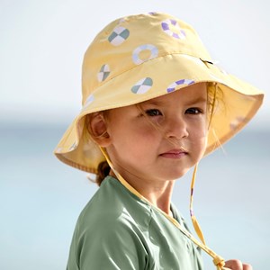 Chapeau réversible anti-uv bouée jaune pâle (3-6 mois)