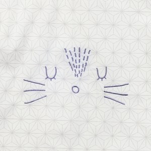 Bavoir élastiqué pompom