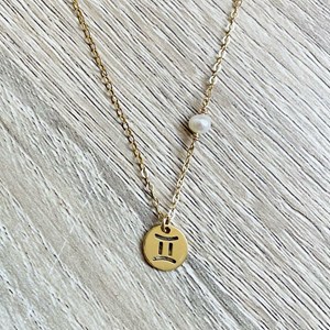 Collier astrée gémeaux perle blanche