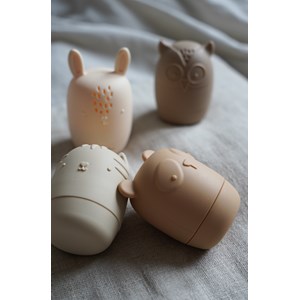 Jouets pour le bain beige