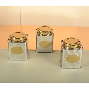 Boîte à thé argentée et dorée