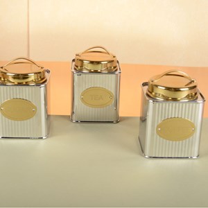 Boîte à thé argentée et dorée