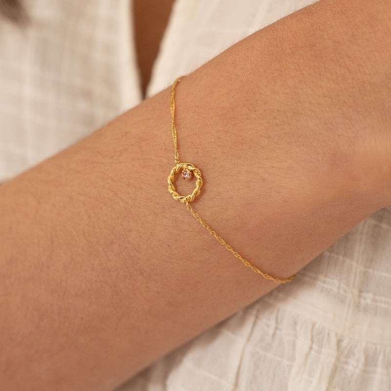 Bracelet doré - connecteur torsadé rose