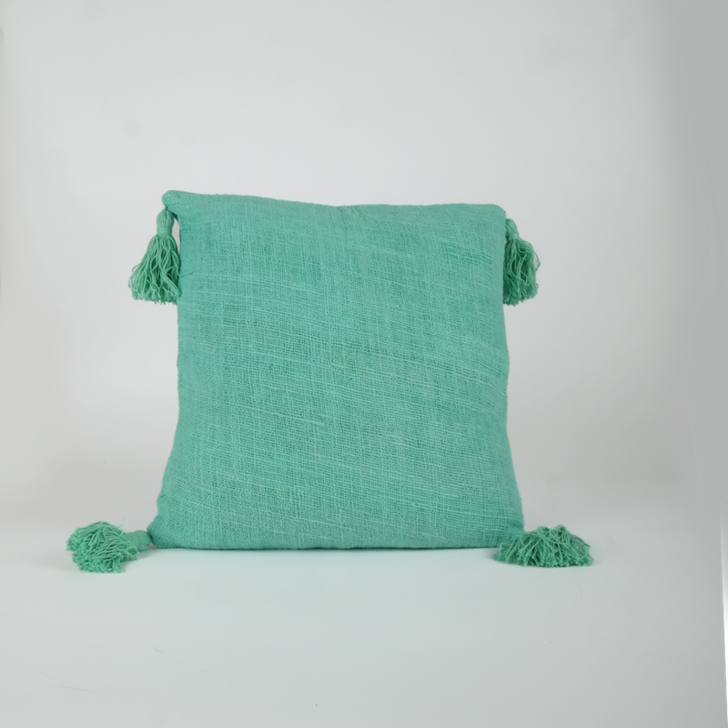 Sud Nomade - Housse de coussin turquoise avec pompons