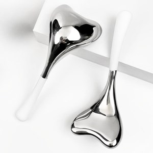 Masseur visage caudale guasha en inox