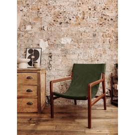 Le fauteuil en tissu bouclette vert