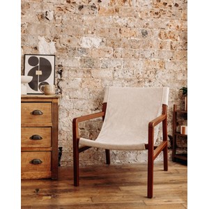 Le fauteuil en tissu bouclette crème