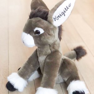 Peluche ane gaston assis 35 cm